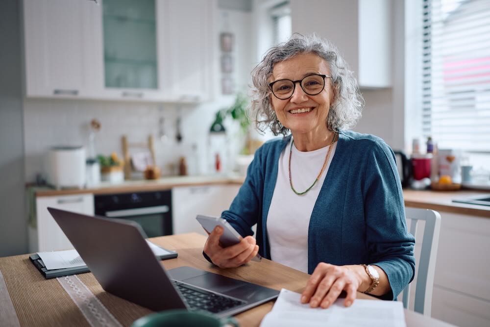 Senior woman smiling looking at a camera